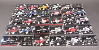 A large collection of 1970's, 80's and 90's 1:42 scale Minichamps Formula One cars, all boxed (30) 