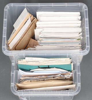 A Nelson stamp album of world stamps, a collection of first day covers and loose stamps on paper, contained in 2 small plastic boxes 