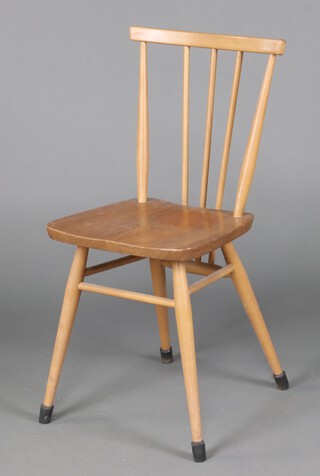 An Ercol beech and elm stick and rail back dining chair 