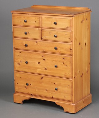 A Ducal pine chest of 4 short and 3 long drawers, raised on bracket feet 118cm h x 86cm w x 46cm d 