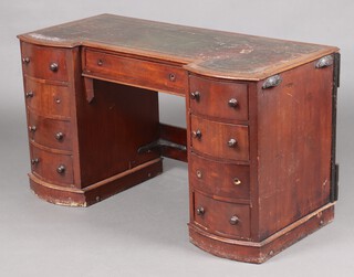 A Victorian mahogany kneehole pedestal dressing table with green inset writing surface, fitted 1 long and 8 short drawers 67cm h x 119cm wide x 54cm d (5 handles missing, metal brace to back) 