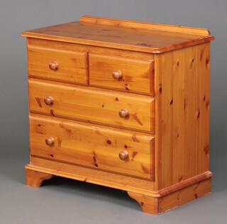 A pine chest with raised back above 2 short and 2 long drawers, on bracket feet 77cm h x 81cm w x 43cm d 