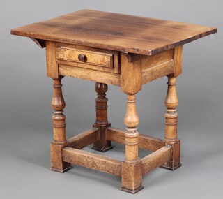 A hardwood side table fitted a drawer, raised on turned and block supports (split to top)  63cm h x 71cm w x 51cm d  