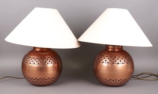 A pair of circular pierced copper table lamps 23cm 