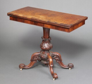 A Victorian rectangular figured walnut card table raised on a baluster turned column and tripod base 75cm h x 91cm w x 45cm d 
