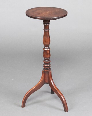 A 19th century circular mahogany wine table, raised on a  turned pillar and tripod base 70cm h x 29cm diam. 