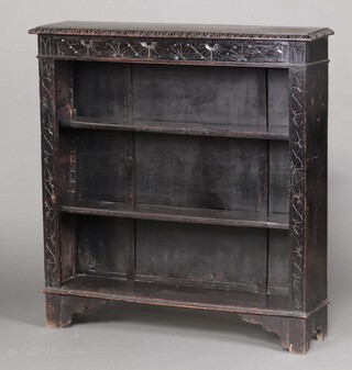 A Victorian ebonised oak bookcase fitted adjustable shelves, raised on bracket feet 96cm h x 106cm w x 26c d 