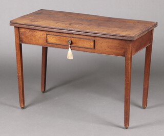 A 18th century rectangular oak tea table  fitted a frieze drawer, raised on square tapered supports 68cm h x 98cm w x 46cm d 