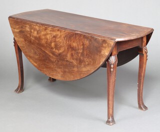 A 19th century mahogany oval drop flap dining table, raised on carved supports with shell knees 70cm h x 137cm w x 47cm d 