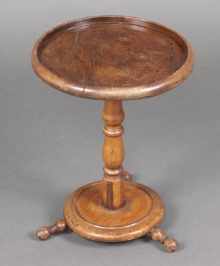 A circular elm and walnut dish top wine table, raised on pillar and tripod supports with turned feet 45cm h x 34cm diam. 