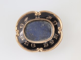 A Victorian gilt metal mourning brooch with black enamel 5cm