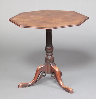 A 19th century octagonal mahogany snap top tea table, raised on turned column and pierced tripod base 66cm h x 70cm w x 69m d  