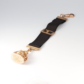 A silk and gilt metal mounted watch hang, hung a 9ct gold seal, gross weight including silk and mounts 16.6g