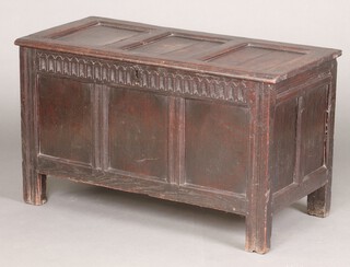An 18th century coffer of panelled construction the interior fitted a candle box with hinged lid 64cm h x 111cm w x 51cm d