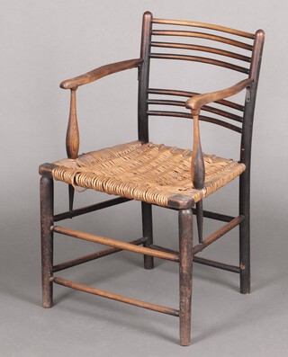 A William Morris Sussex arm chair with woven cane seat 