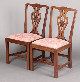 A pair of 19th century mahogany Chippendale style dining chairs with pierced vase shaped slat backs and upholstered drop in seats 