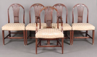 A set of 5 19th century Hepplewhite style dining chairs (1 carvers, 4 standard) with pierced vase shaped slat backs and overstuffed seats, raised on square tapered supports with H framed stretchers 