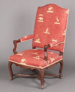 A 17th/18th century walnut show frame armchair, the seat and back upholstered in green and gold material, raised on cabriole supports with X framed stretcher 