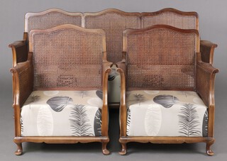 A 1950's mahogany double cane bergere suite comprising 2 seat sofa and 2 matching armchairs 