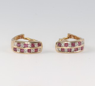 A pair of 9ct gold diamond and ruby set earrings