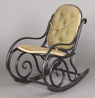 A Thonet style bentwood ebonised rocking armchair, the seat and back upholstered in green material 