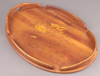A Fijian inlaid hardwood twin handled tea tray decorated the Islands of Fiji and presented by Latchml Prrsad, the reverse dated 10.10.1974 51cm w x 36cm d 