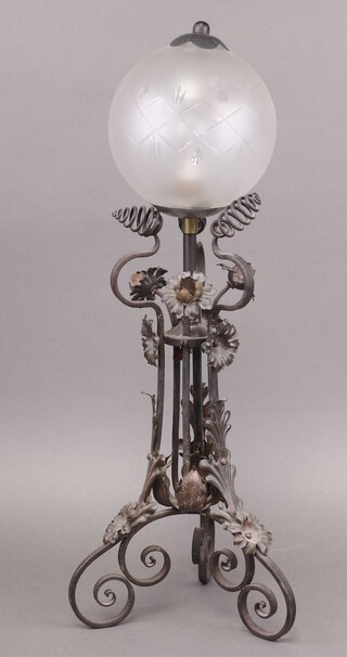 An Edwardian wrought metal table lamp with etched glass globular shaped shade 60cm 