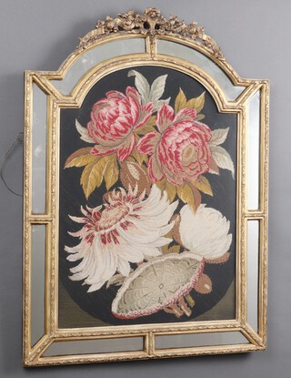 A 19th century arched Berlin wool work panel of roses bordered by a plate mirror, contained within a gilt plaster frame 87cm h x 63cm w 