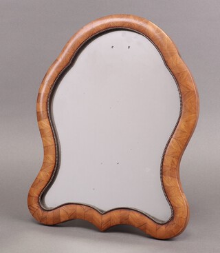 A 19th century shaped Continental mirror contained in a Kingwood easel frame 35cm h x 48cm w  