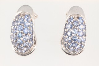 A pair of 9ct white gold earrings set Ceylon sapphires 5.3g
