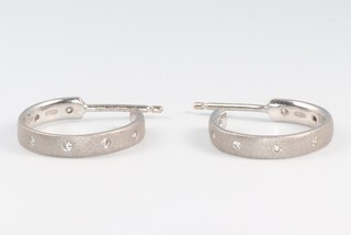 A pair of 18ct white gold and diamond set hoop earrings 4.8g