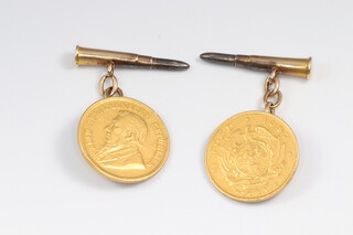 A pair of cufflinks formed from an 1896 and an 1897 South African half pond, the cufflink backs in the form of bullets, gross weight 13.2g
