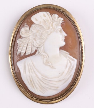 A shell carved cameo portrait brooch of a lady in a gilt metal mount 5cm 