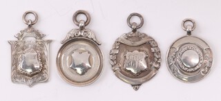 Four silver sporting watch chain medallions, 35g