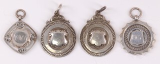 Four silver sporting watch chain medallions, 31g 