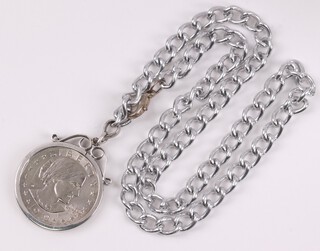 An American 1979 1 dollar coin in a silver mount, hung on a metal chain 