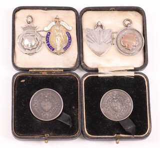 Two silver sports medals together with 4 silver sporting watch chain medallions, 63g 