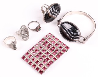 A silver bracelet set an oval hardstone panel, London 1974, together with a matching ring size S, a marcasite ring marked 935 size O, 2 other rings and a buckle