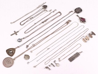 A collection of silver jewellery including ingot pendant, Tudor rose pendant hung on a fine chain, Zodiac crab pendant on a chain, St Christopher, pair of cufflinks, ankle chain, other silver chains, 70 grams gross 