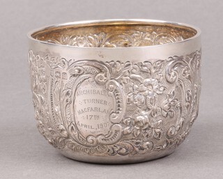 An Edwardian circular embossed silver bowl London 1904, with inscription, 72g