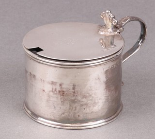 A Georgian silver mustard pot with blue glass liner, the lid with armorial decoration, Sheffield 1812, marks rubbed, 118g 