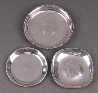 A Sterling 925 dish set a coin 12cm, a 925 dish set a coin 9cm, 172g and an 835 dish with embossed decoration 52g 