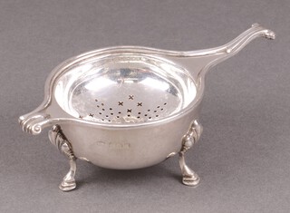 A silver tea strainer and stand, Birmingham 1939 by Andrew Swingler, marks slightly rubbed, 105g 