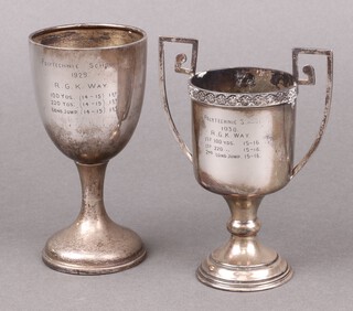 A silver goblet shaped trophy cup Birmingham 1928, inscribed, together with a silver twin handled trophy cup Birmingham 1924 (slightly misshapen) 168 grams 