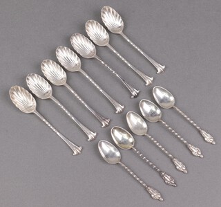 A set of 7 silver coffee spoons with spiral turned shafts and scalloped bowls, Sheffield 1890 by Henry Atkin Brothers and 5 silver apostle spoons Birmingham 1900 by William Henry Leather, 130g 