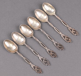 Six pierced silver coffee spoons with floral picture backs, London 1909 by The Goldsmiths and Silversmiths Company, 81g 