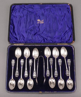 A cased set of 12 Victorian pierced silver coffee spoons and tongs with engraved bowls, Sheffield 1897, by Atkin Brothers, 157g 