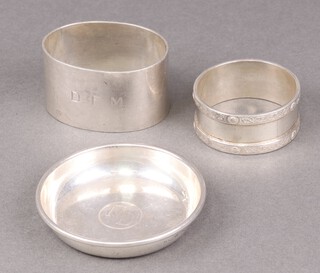 A silver napkin ring Sheffield 1942 by Harrison Brothers, a 925 napkin ring and  a circular silver dish Birmingham 1971, 103g