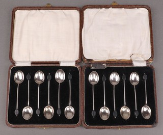 Two cased sets of 6 silver bean end coffee spoons Birmingham 1924, marks rubbed, 171g gross