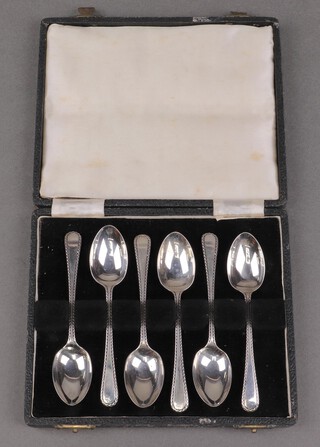 A cased set of 6 silver coffee spoons with bright cut decoration, Sheffield 1917 by James Dixon & Sons, 73g 